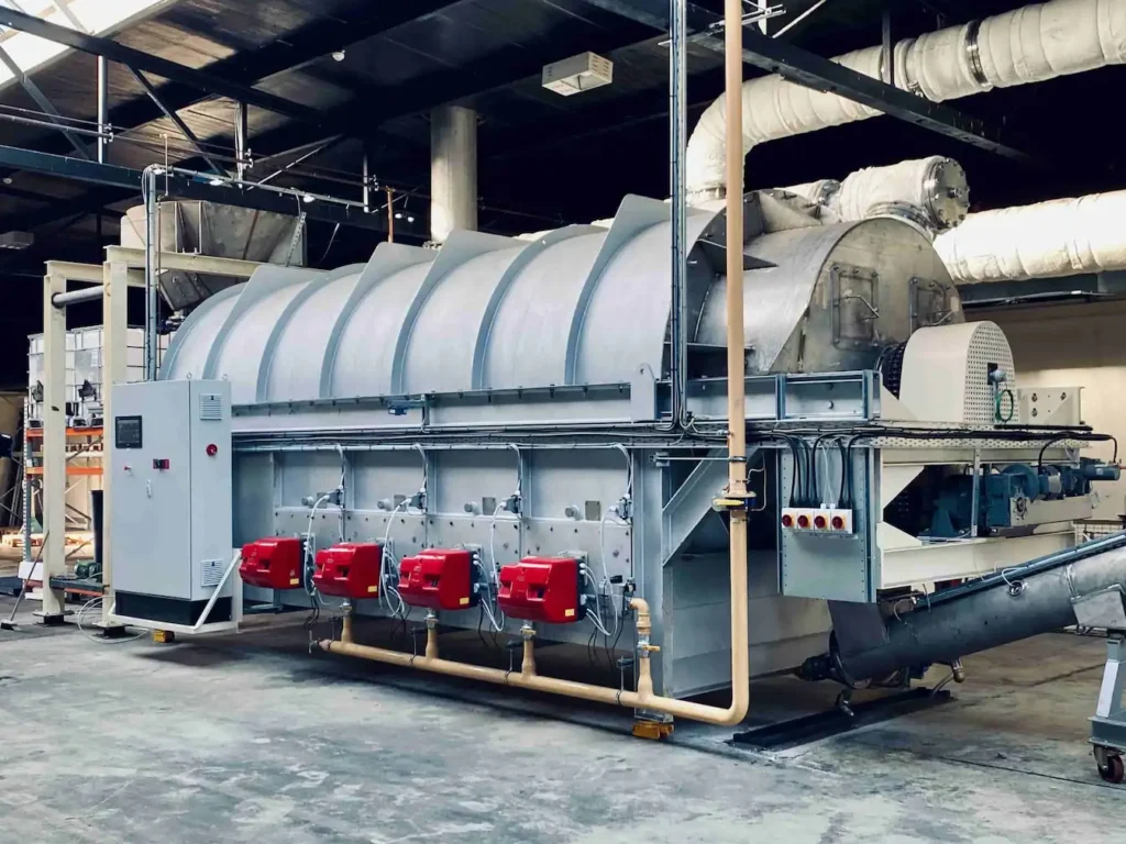 an industrial, commercial scale indirect fired rotary kiln inside a warehouse